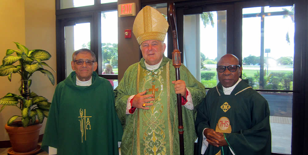 Archbishop Wenski with Fr. Muniz and Fr. Francis